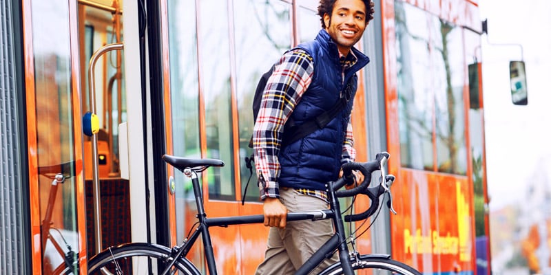 man walking with a bike
